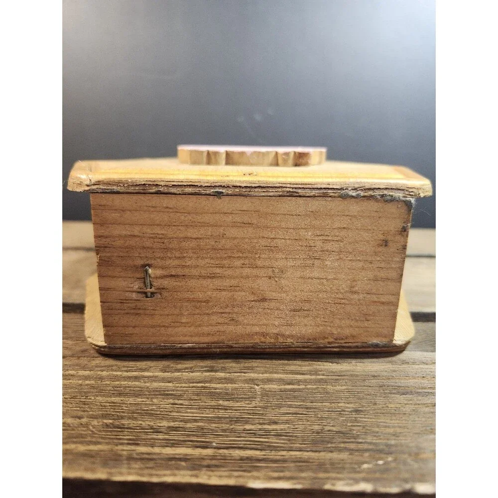 vintage wooden napkin holder features a farmhouse-style pig
